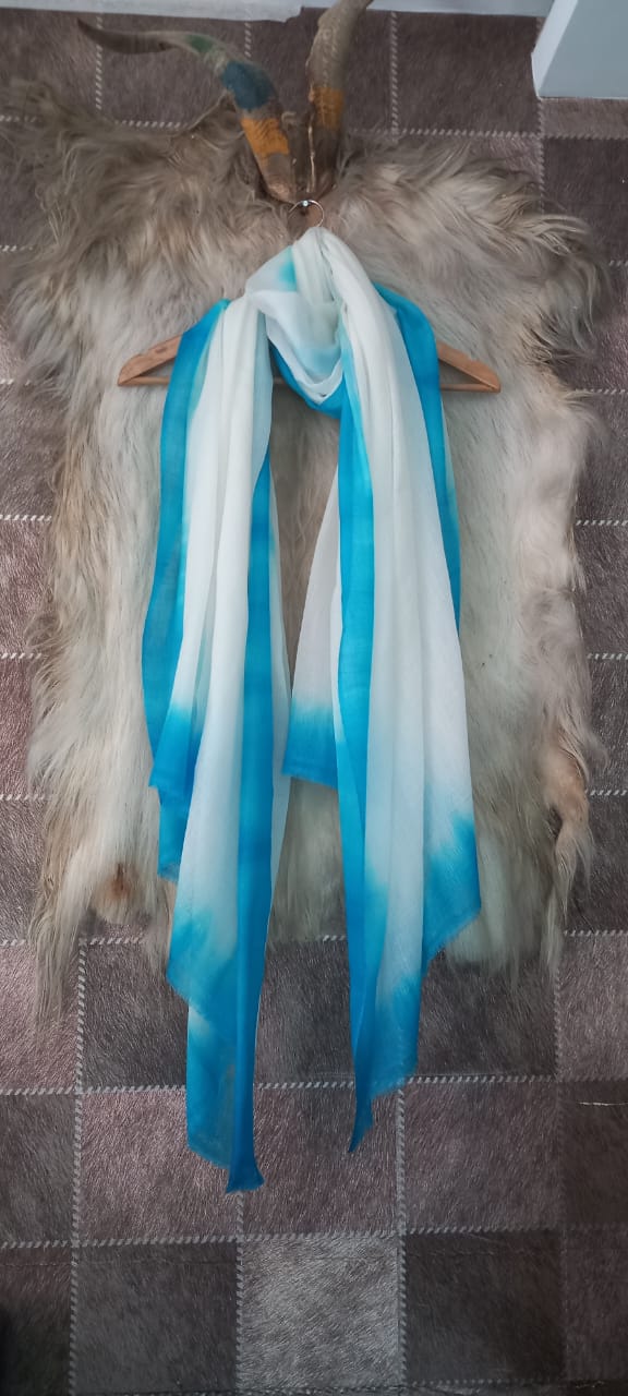 Ombré dyed cashmere stole showing graduated colour
