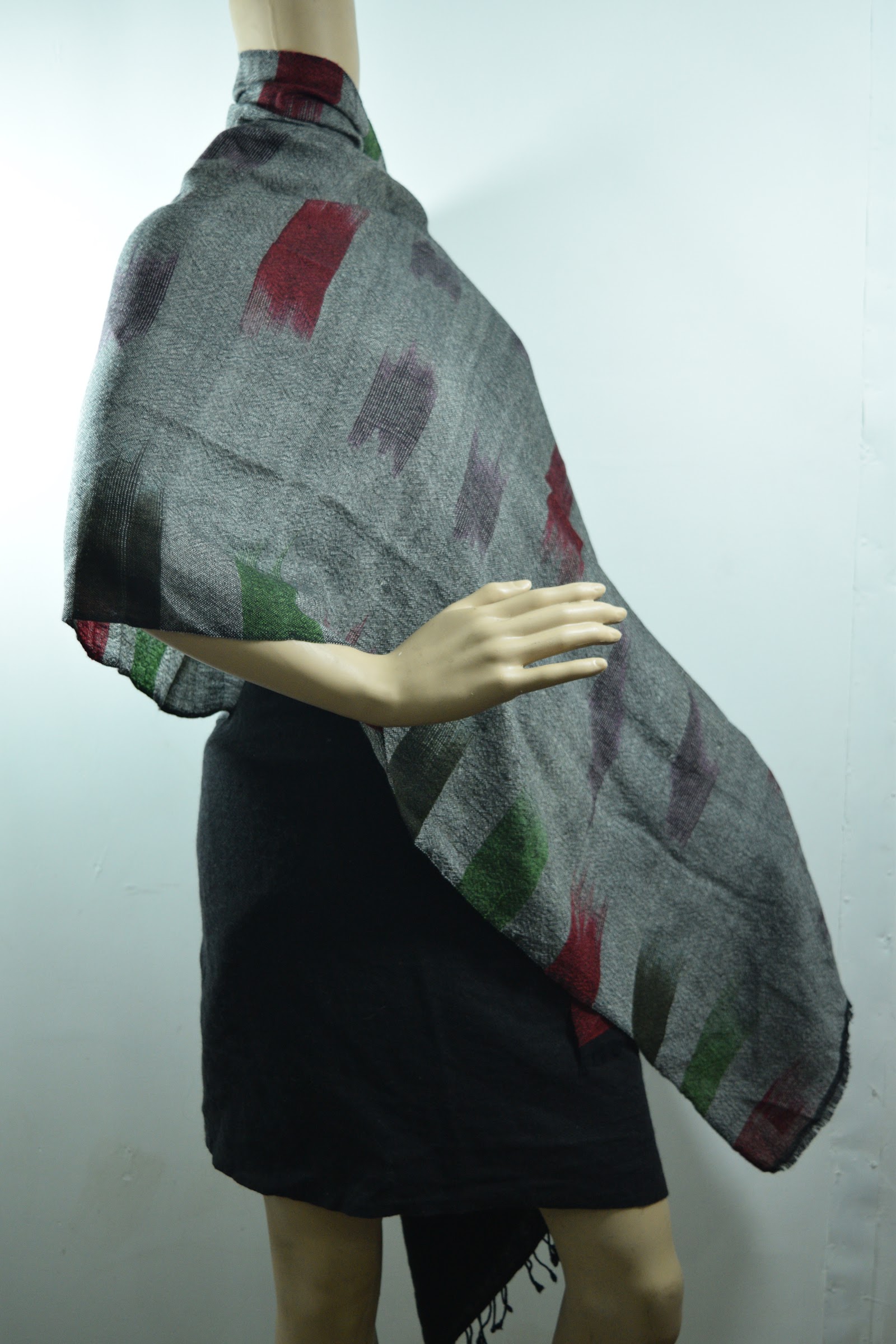 Grey woven cashmere stole with red and green woven motifs