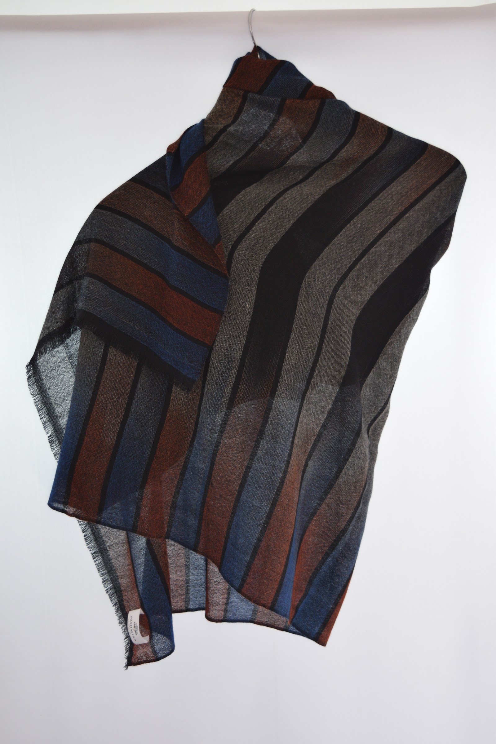 Striped woven cashmere stole on a hanger, a Pashmina Studio sample